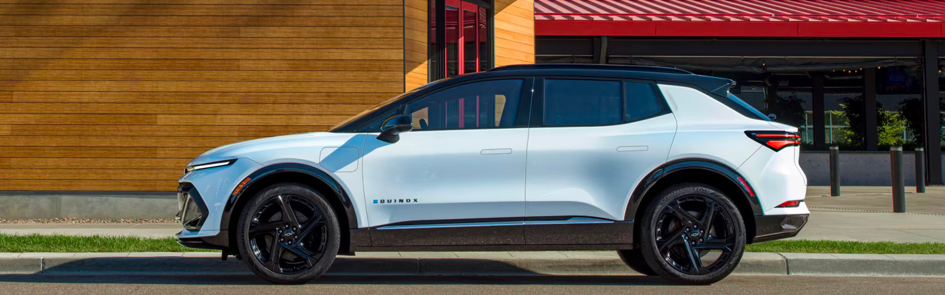 2025 Chevrolet Equinox EV is parked on a street.
